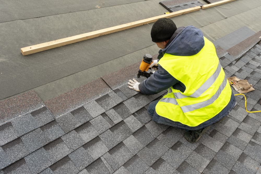 Worker Fixing Metal Roof