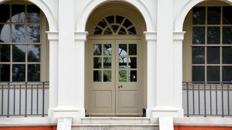 Beige wood front door - Pinnacle Home Improvements